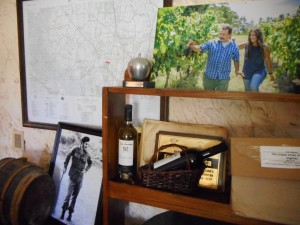 Reinaldo and Agostina De Lucca’s photograph on shelf in tasting room, next to a vineyard map and Che…