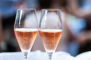 Two glasses filled with pink champagne